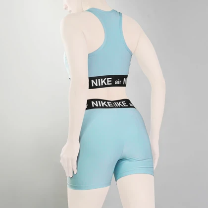 ست نیم‌تنه و کشاله بند ورزشی زنانه نایک مدل VHD-3E792 آبی روشن