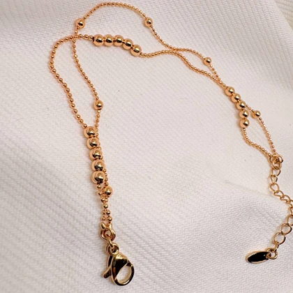 دستبند ژوپینگ مدل «البرنادو» (دوریکا) | رقص گوی‌های طلایی دور مچ