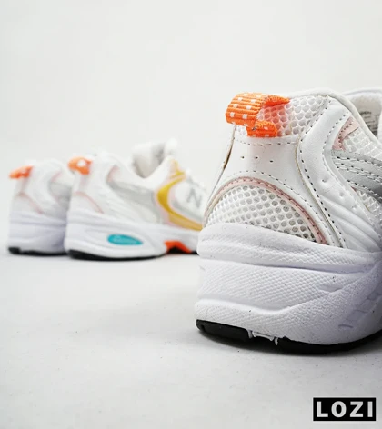 کفش کتانی زنانه صورتی زرد NEW BALANCE 530
