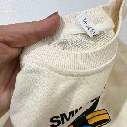 بلوز دورس کرم SMILING BAND طرح هیولا