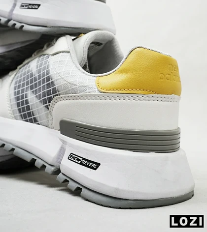 کفش کتانی سفید طوسی زرد NEW BALANCE 1300
