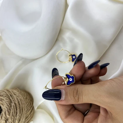 گوشواره زنانه حلقه‌ای مدل پناه طرح پروانه و چشم نظر رنگ طلایی