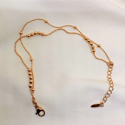 دستبند ژوپینگ مدل «البرنادو» (دوریکا) | رقص گوی‌های طلایی دور مچ