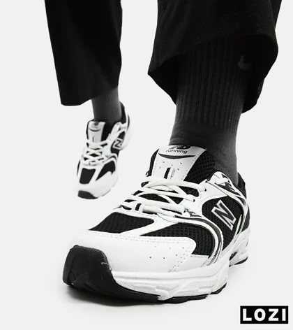 کفش کتانی مردانه و زنانه سفید مشکی NEW BALANCE 530 مدل 3144