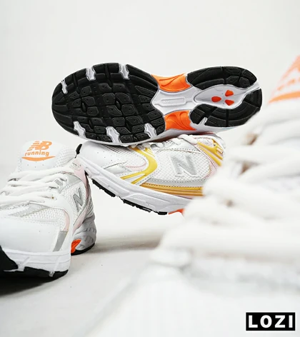 کفش کتانی زنانه صورتی زرد NEW BALANCE 530