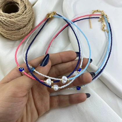 گردنبند زنانه مهره ای مدل صدف طرح چشم نظر و مروارید دو رنگ