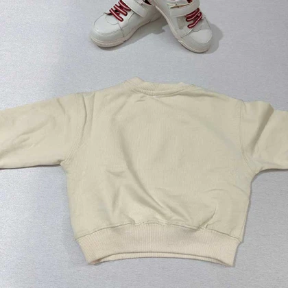 بلوز دورس کرم SMILING BAND طرح هیولا