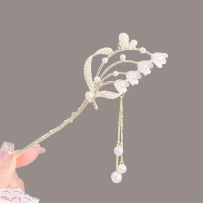 گیره مو زنانه مدل کانزاشی طرح سبد گل های شیپوری آویزدار