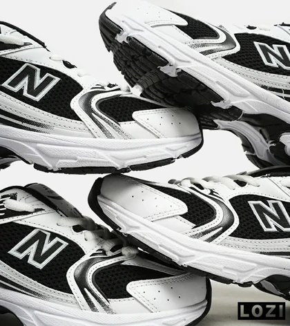 کفش کتانی مردانه و زنانه سفید مشکی NEW BALANCE 530 مدل 3144