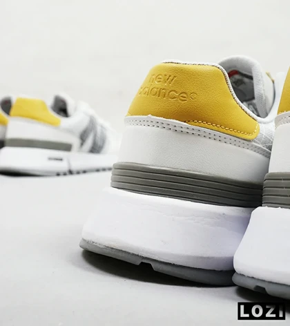 کفش کتانی سفید طوسی زرد NEW BALANCE 1300