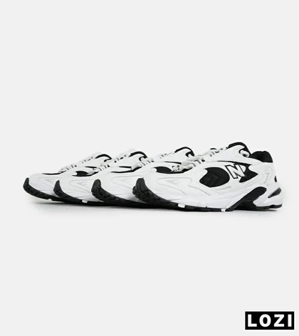 کفش کتانی مردانه و زنانه سفید مشکی NEW BALANCE 725