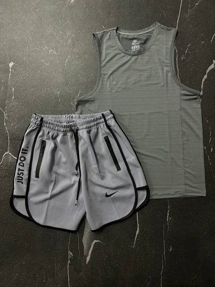 پکیج کد S245 شامل رکابی آستین حلقه‌ای+ شلوارک نایکی با تم طوسی