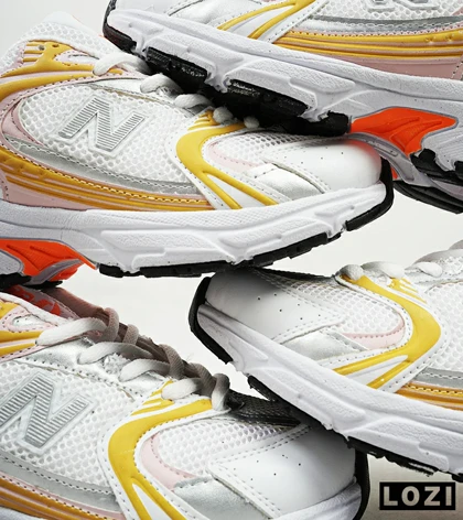 کفش کتانی زنانه صورتی زرد NEW BALANCE 530