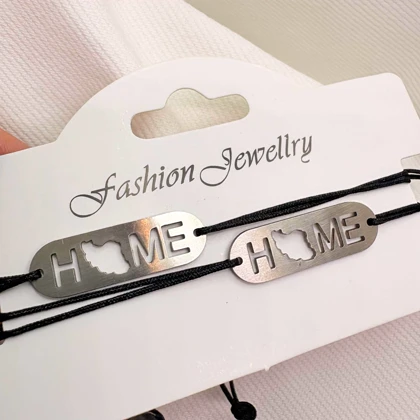 دستبند استیل مدل «HOME - ایران» | بند بافت مشکی با پلاک نقره‌ای