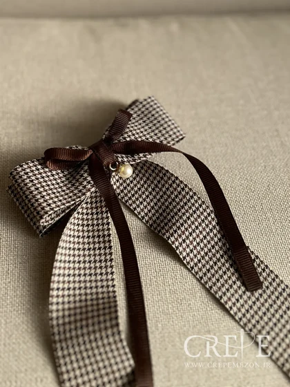 گیره پاپیون و مروارید دنباله دار