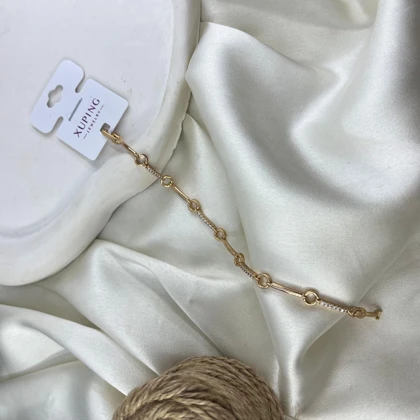 دستبند زنانه ژوپینگ مدل درخشان طرح نگین‌دار طلایی