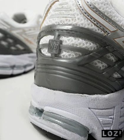 کفش کتانی سفید طوسی طلایی Newbalance 1906R