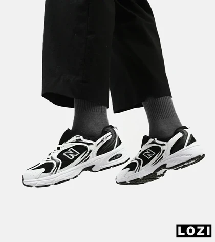 کفش کتانی مردانه و زنانه سفید مشکی NEW BALANCE 530 مدل 3144