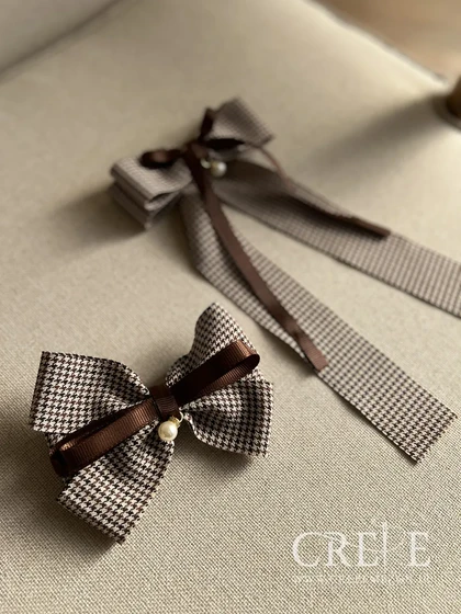 گیره پاپیون و مروارید دنباله دار