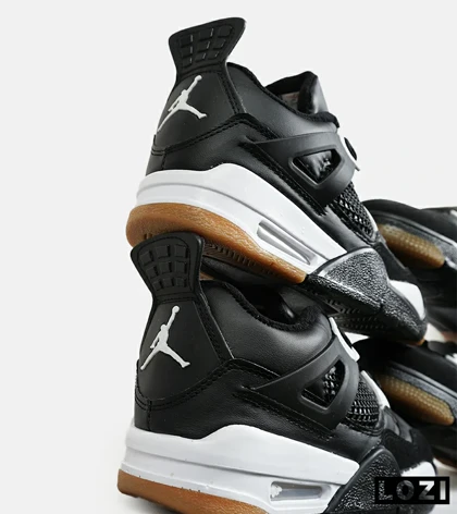 کتانی ساق‌دار بزرگ پا مشکی سفید Nike air jordan 4