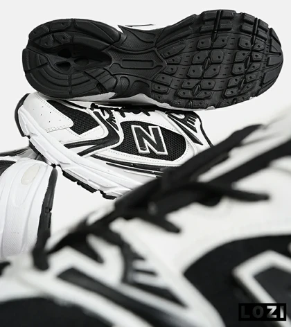 کفش کتانی مردانه و زنانه سفید مشکی NEW BALANCE 530