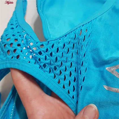 نیم‌تنه ورزشی زنانه جیر مدل پشت قهرمانی پددار آبی روشن
