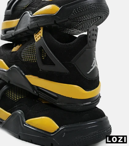 کفش کتانی ساق‌دار مردانه مشکی زرد Nike air jordan 4
