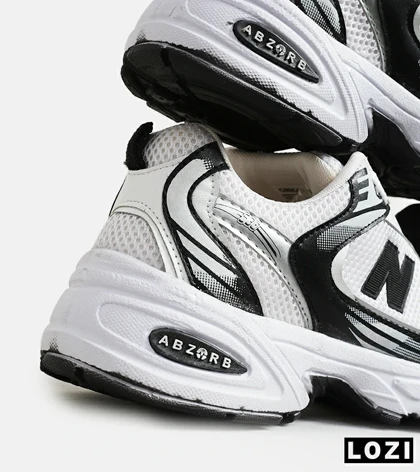 کفش کتانی مردانه و زنانه سفید طوسی مشکی NEW BALANCE 530