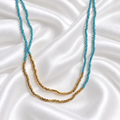 گردنبند دو ردیفه مهره‌ای فیروزه‌ای طلایی مراقبتی