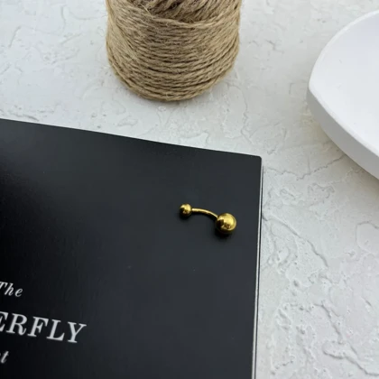 پیرسینگ ناف زنانه طرح طلا مدل توپی