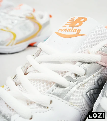 کفش کتانی زنانه صورتی زرد NEW BALANCE 530