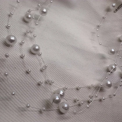 گردنبند نامرئی طرح «مروارید معلق» (Illusion Necklace) | مینیمال و اقتصادی