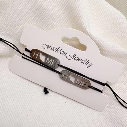 دستبند استیل مدل «HOME - ایران» | بند بافت مشکی با پلاک نقره‌ای