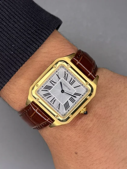 ساعت مچی کارتیه دومونت بند چرمی قهوه ای قاب طلایی Cartier