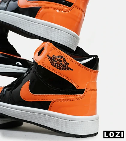 کفش کتانی مردانه و زنانه ساق‌دار مشکی نارنجی ورنی NIKE jordan 1 مدل 6219