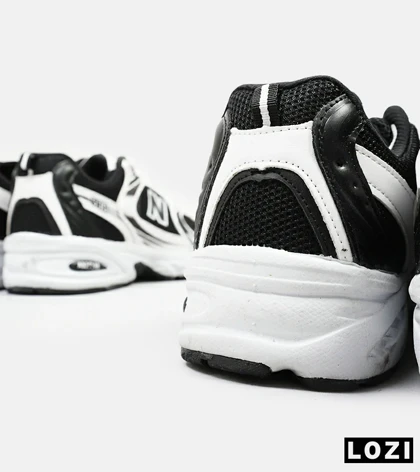 کفش کتانی مردانه و زنانه سفید مشکی NEW BALANCE 530
