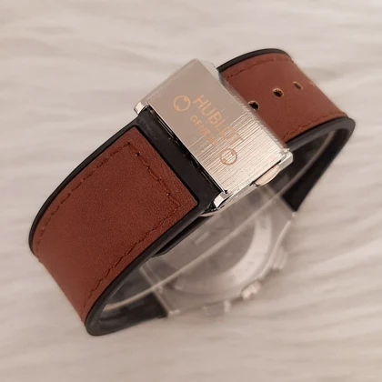 ساعت مردانه هابلوت بند قهوه ای قاب نقره ای