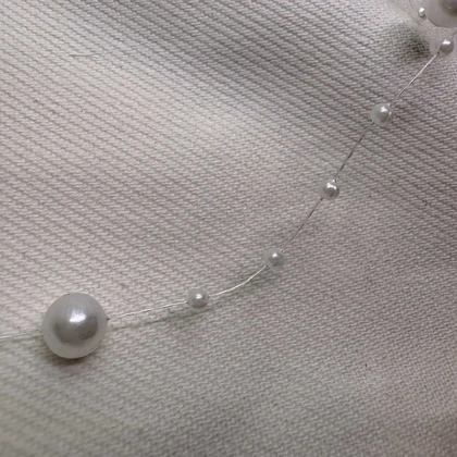 گردنبند نامرئی طرح «مروارید معلق» (Illusion Necklace) | مینیمال و اقتصادی