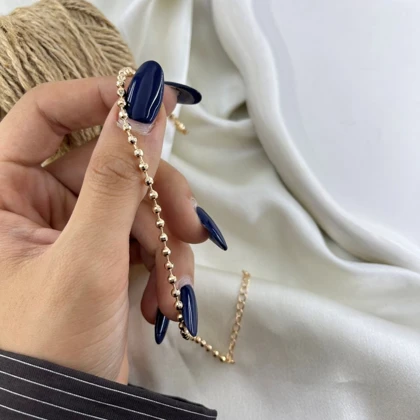 پابند زنانه توپی مدل درخشان رنگ طلایی