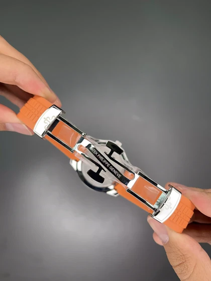 ساعت مچی پتک فیلیپ آکوانا بند رابر نارنجی صفحه مشکی Patek Philippe Aquanaut