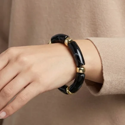 دستبند زنانه بنگل رزینی چندتکه مدل نوآرا مشکی‑طلایی