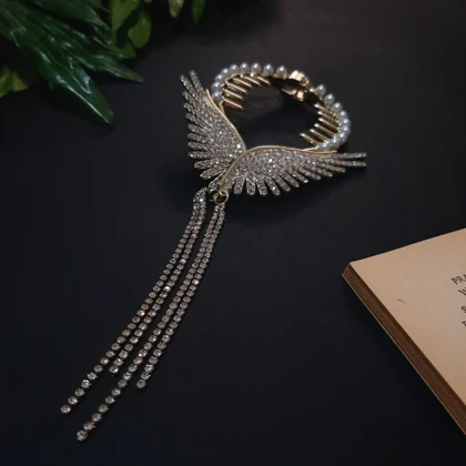 گیره مو زنانه مدل آبشاری گوجه ای طرح بال فرشته آویز دار