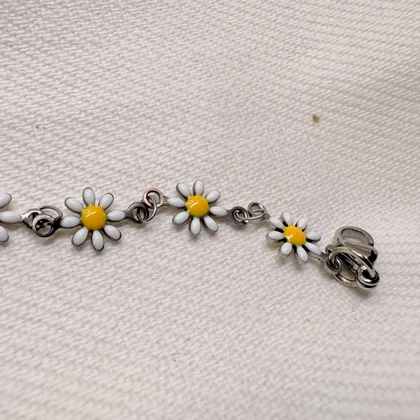 دستبند گل بابونه استیل نقره ای