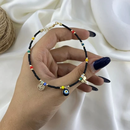 پابند زنانه مهره ای مدل نگین طرح سکه چشم نظر رنگی