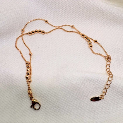 دستبند ژوپینگ مدل «البرنادو» (دوریکا) | رقص گوی‌های طلایی دور مچ