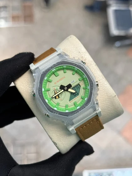 ساعت جی شاک2100بند برزنتی عسلی صفحه سبز
