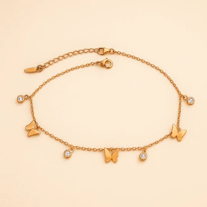 پابند زنانه استیل طلایی با آویز پروانه و نگین – Xuping