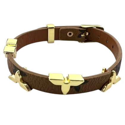 دستبند زنانه چرمی با طرح گل‌های طلایی
