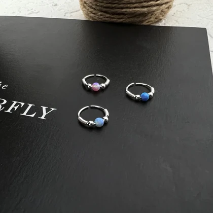 پیرسینگ بینی حلقه‌ای با نگین اوپال زنانه