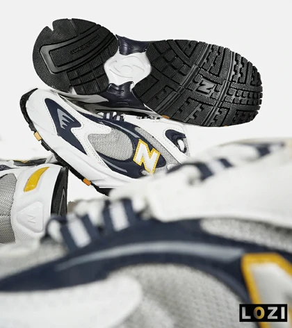 کفش کتانی مردانه و زنانه طوسی زرد مشکی NEW BALANCE 725
